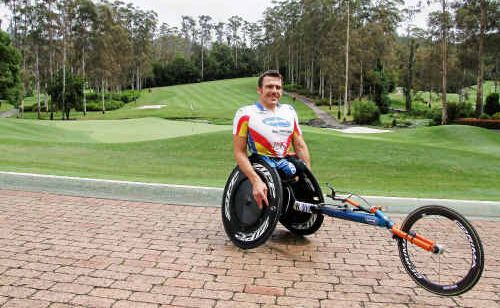 Kurt Fearnley with his racing machine at Bonville Golf Resort. Kurt Fearnley with his racing machine at Bonville Golf Resort.
